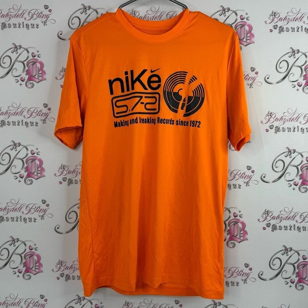 Nike tshirt dri-fit the Nike tee since 1972 Orange Graphic Short Sleeve Tee